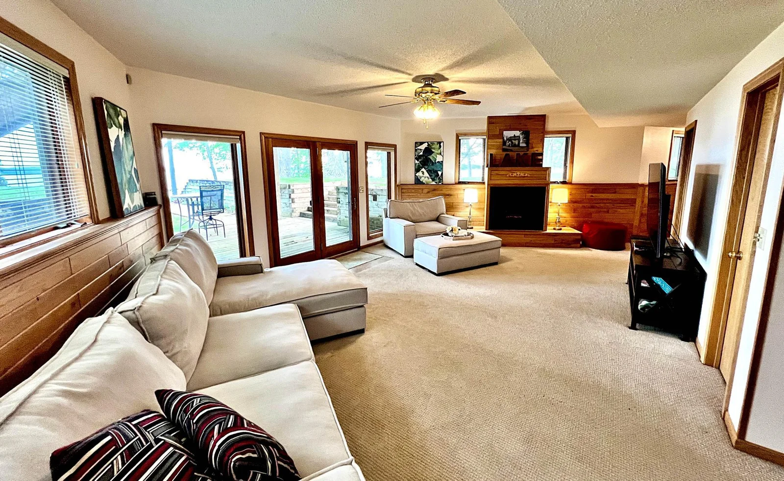 Living room with fireplace and lake views.jpg