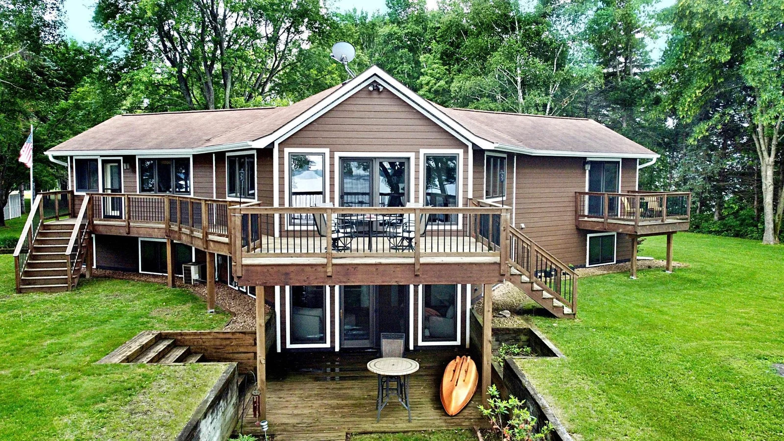 Lakeside view of home with Wrap around deck.jpg