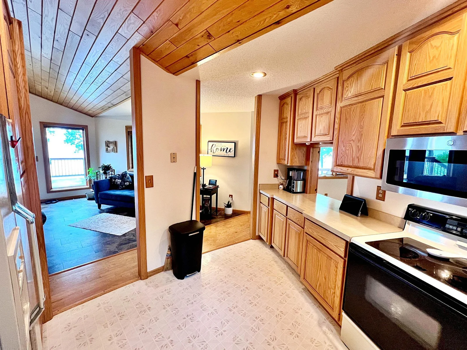 Kitchen Views to Living room and Farm Island Lake.jpg