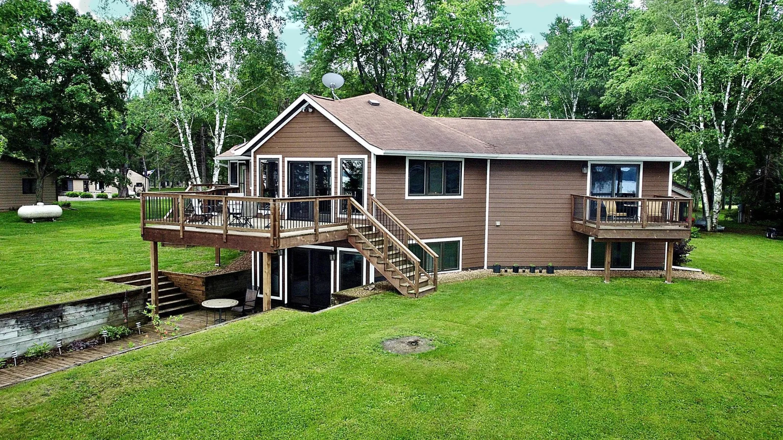 View of Lakeside deck and grassy yard.jpg
