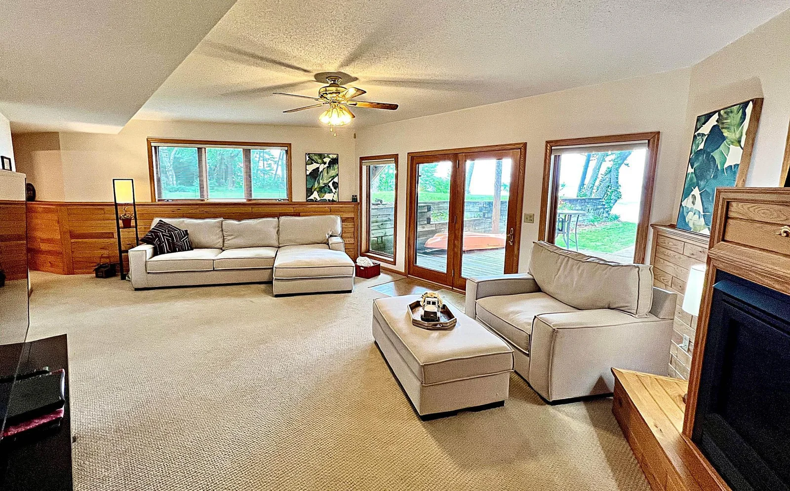 Family room with fireplace and lake views lower level walkout.jpg