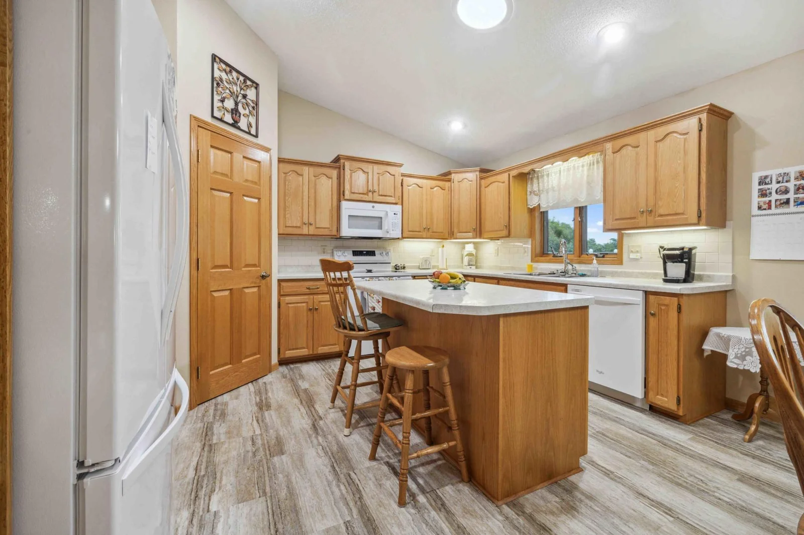 Kitchen has plenty of space and a corner pantry.
