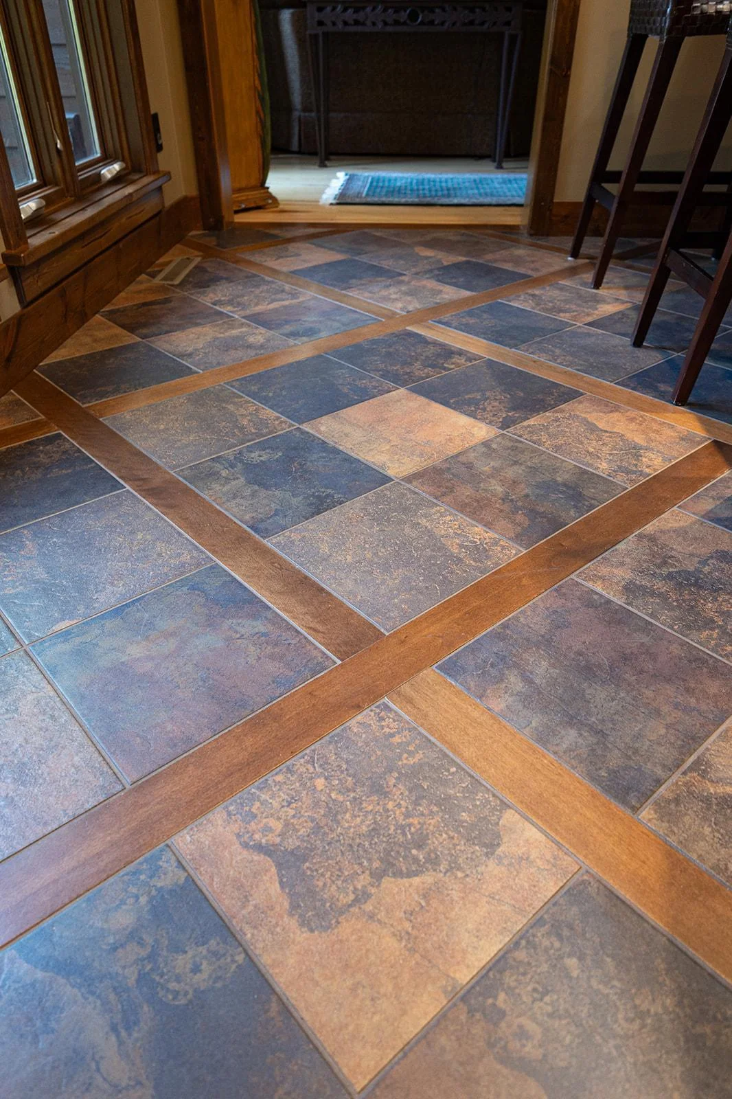 Custom inlaid wood and ceramic tile floors