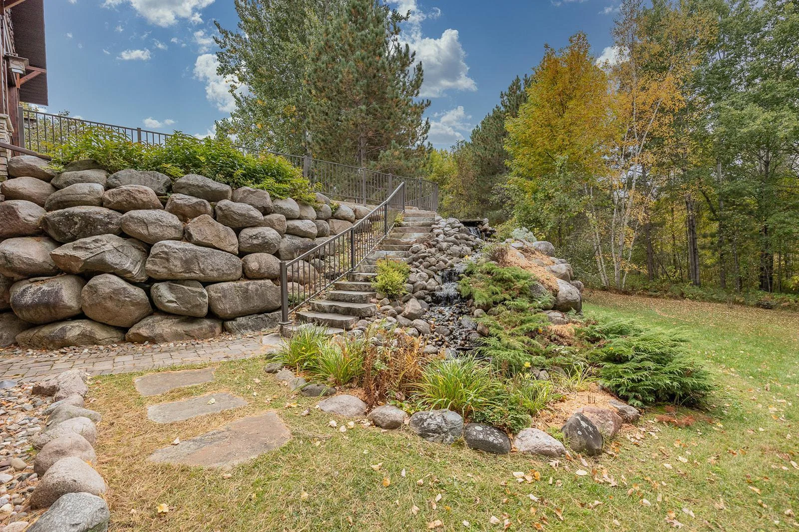 Boulder landscaping with tranquil fountain
