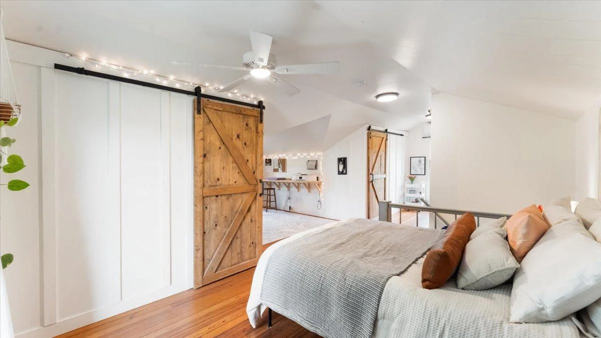 The upstairs bedroom features fir hardwood floors, double walk-in closets, and a private ensuite bathroom.