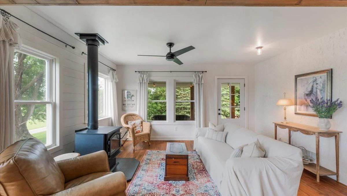 Living room features a wood burning stove.