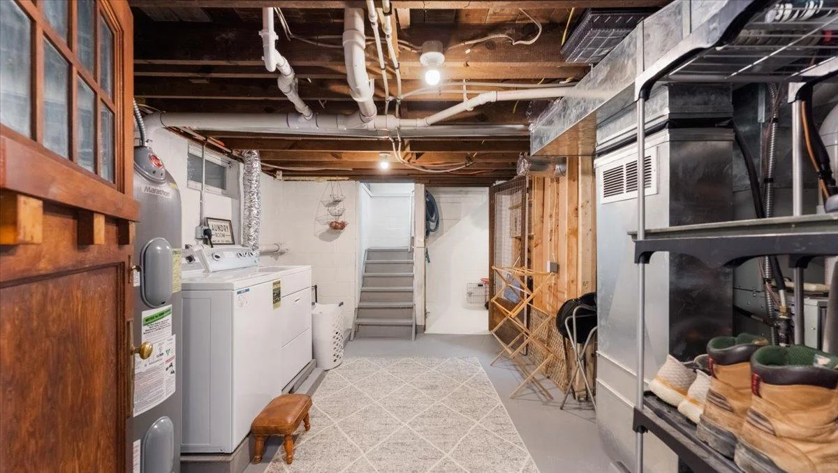 Lower level also features the laundry room and additional storage space.
