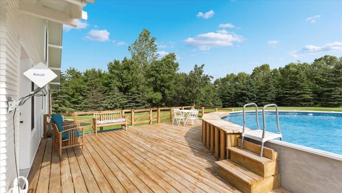 Enjoy the deck off of the back of the house, complete with an above-ground pool!