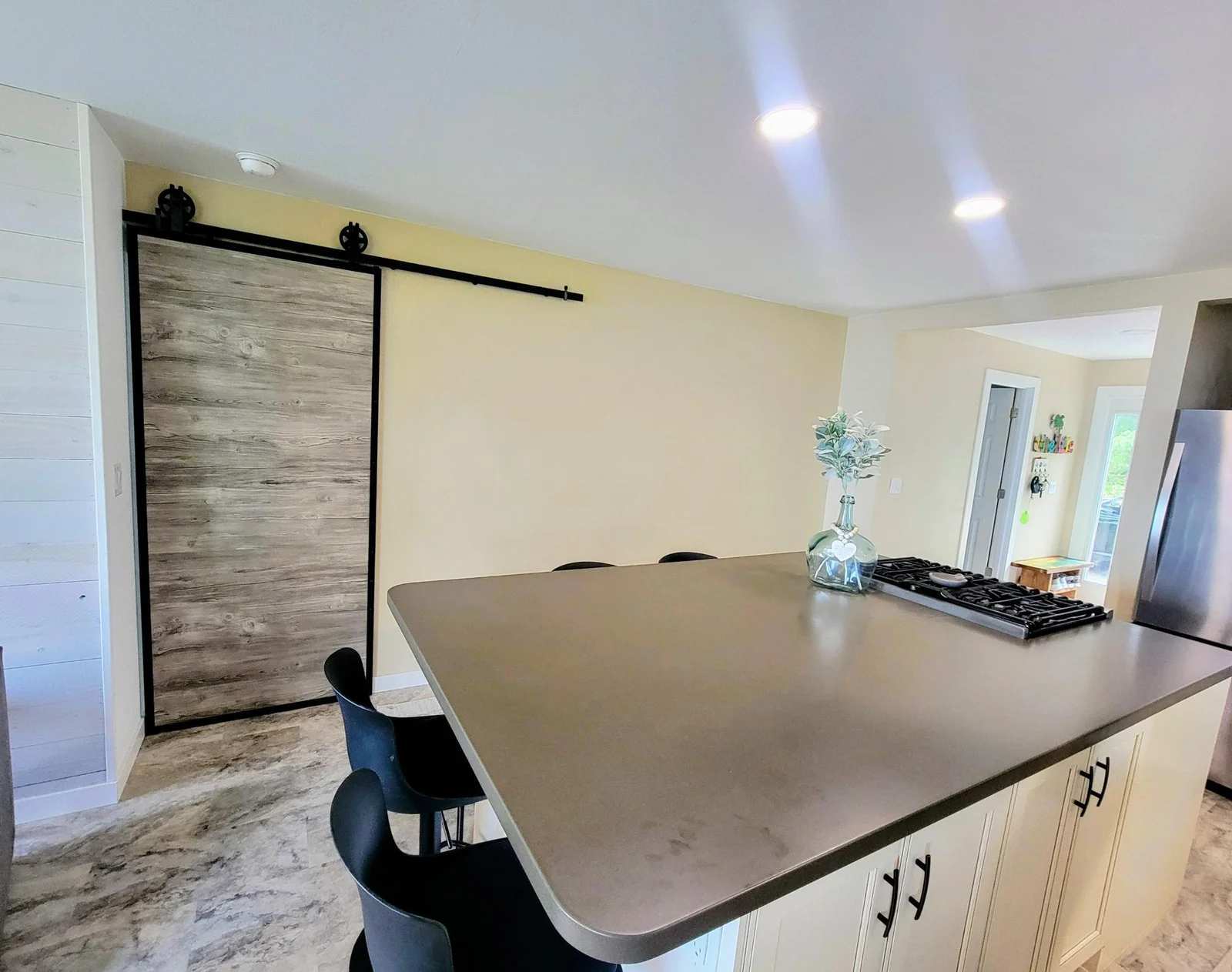 Barn Door Provides Privacy to Primary Suite