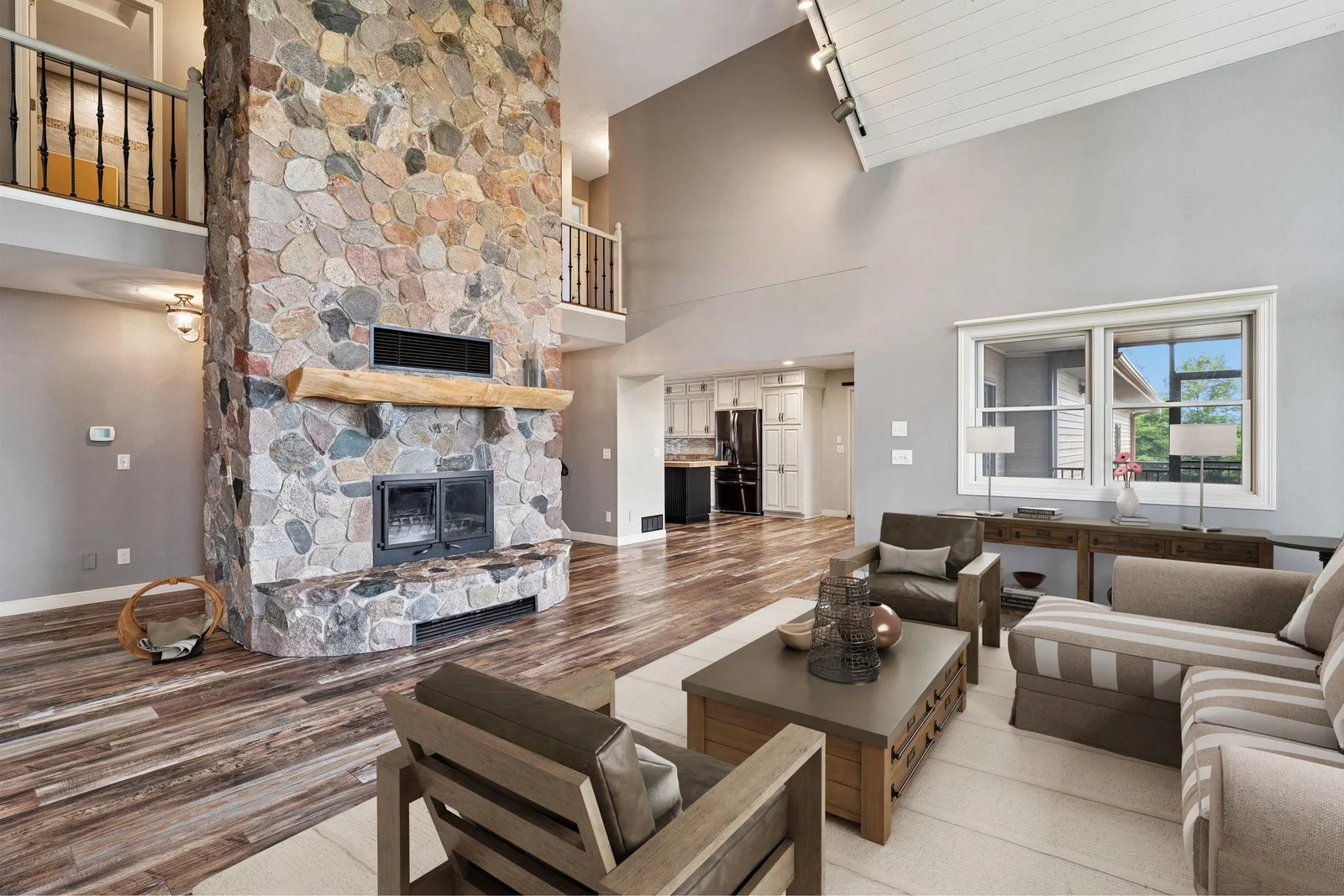 Wood burning stone fireplace (virtually staged)
