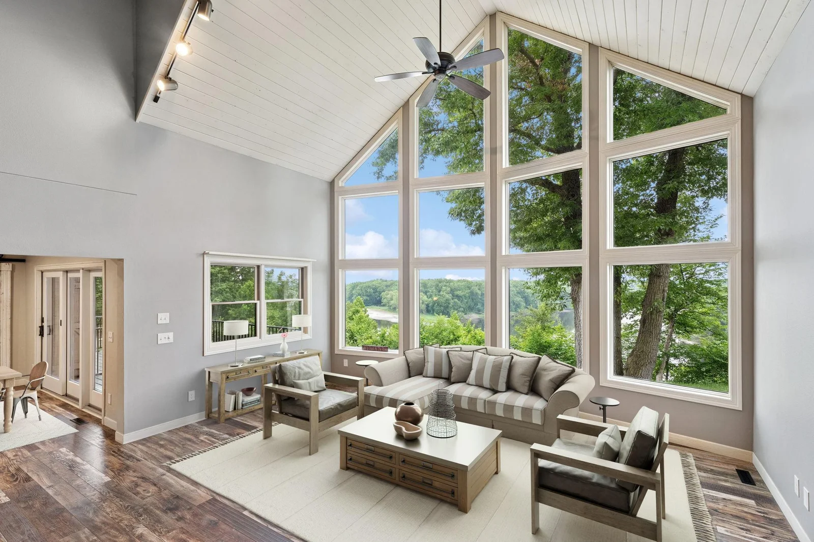 Great room with amazing views of the river (virtually staged)