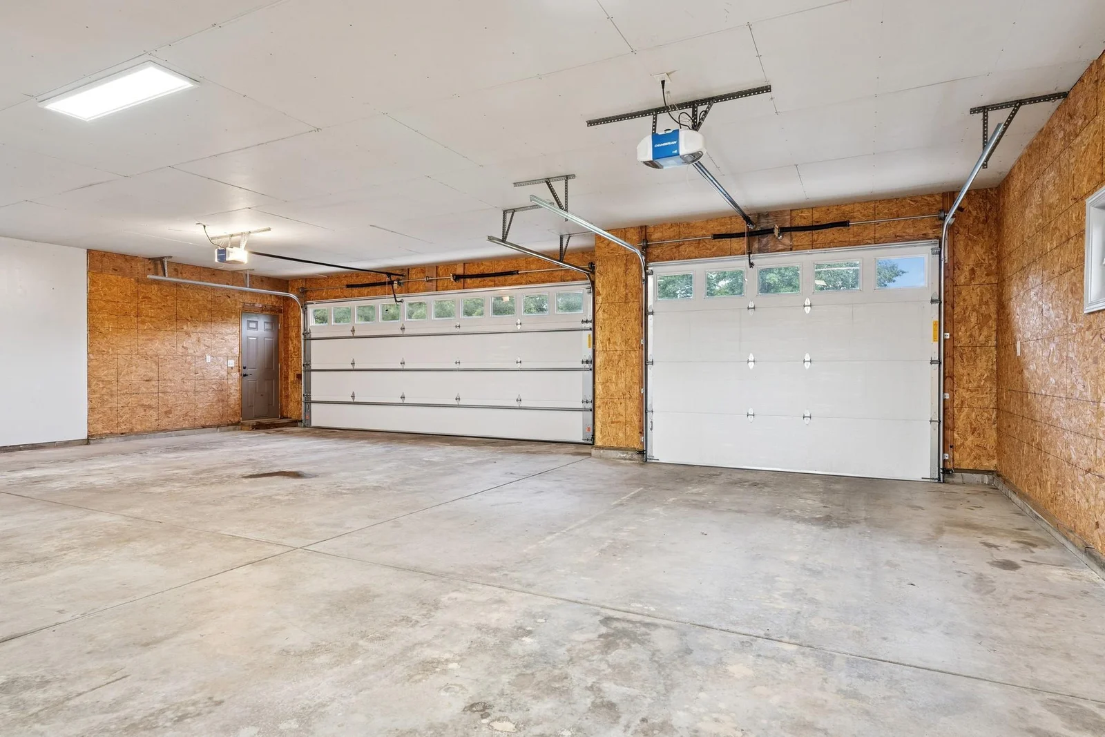 Large garage, third stall is extra deep perfect for trailers and toys