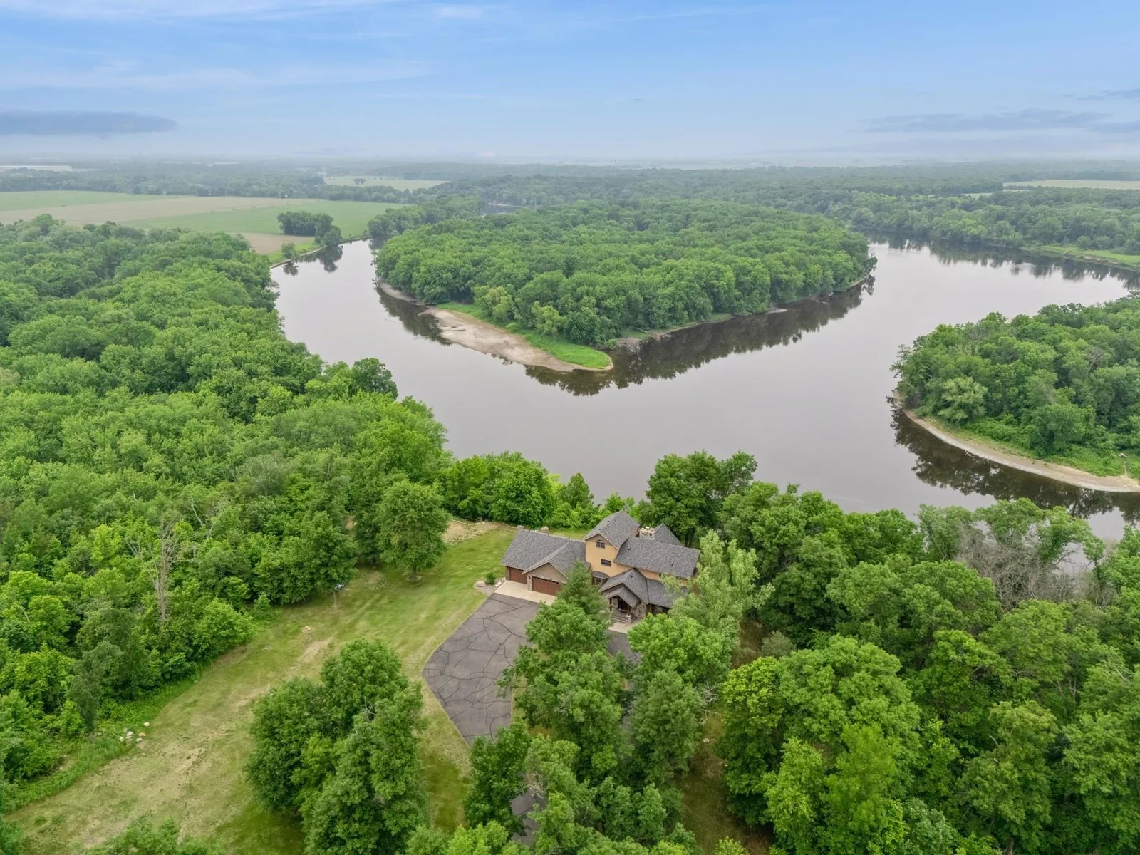 Views of the Mississippi where it splits around the wooded Island
