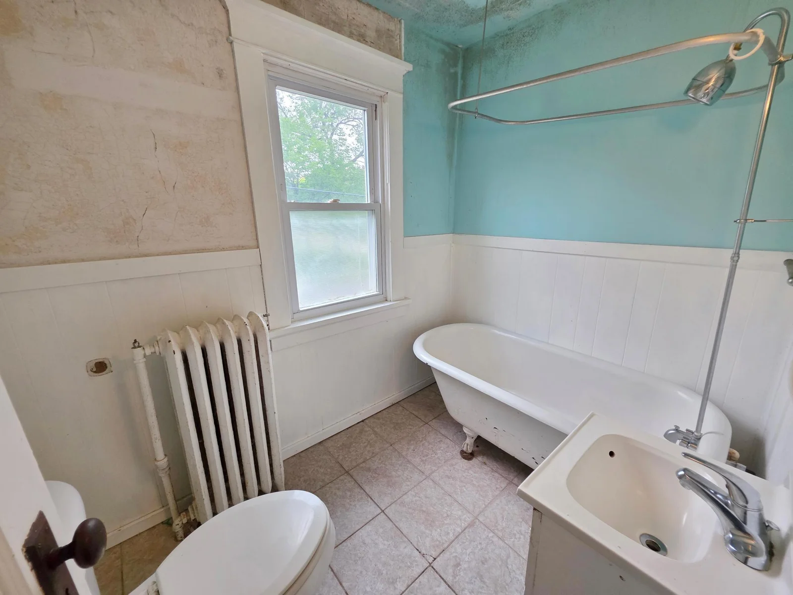 4 Bedroom 2 bathroom home on corner lot with lots of potential! 2 car detached garage. Possible investment home?