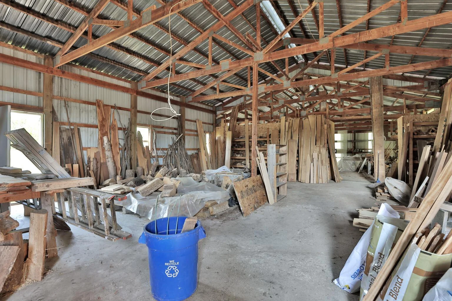 Interior of pole barn. East half has concrete floor