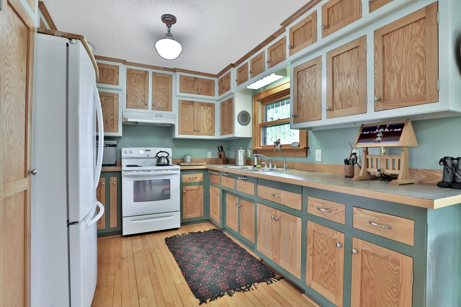 Plenty of cabinetry. The cabinet to the right of the sink can be removed for a dishwasher if one wanted.