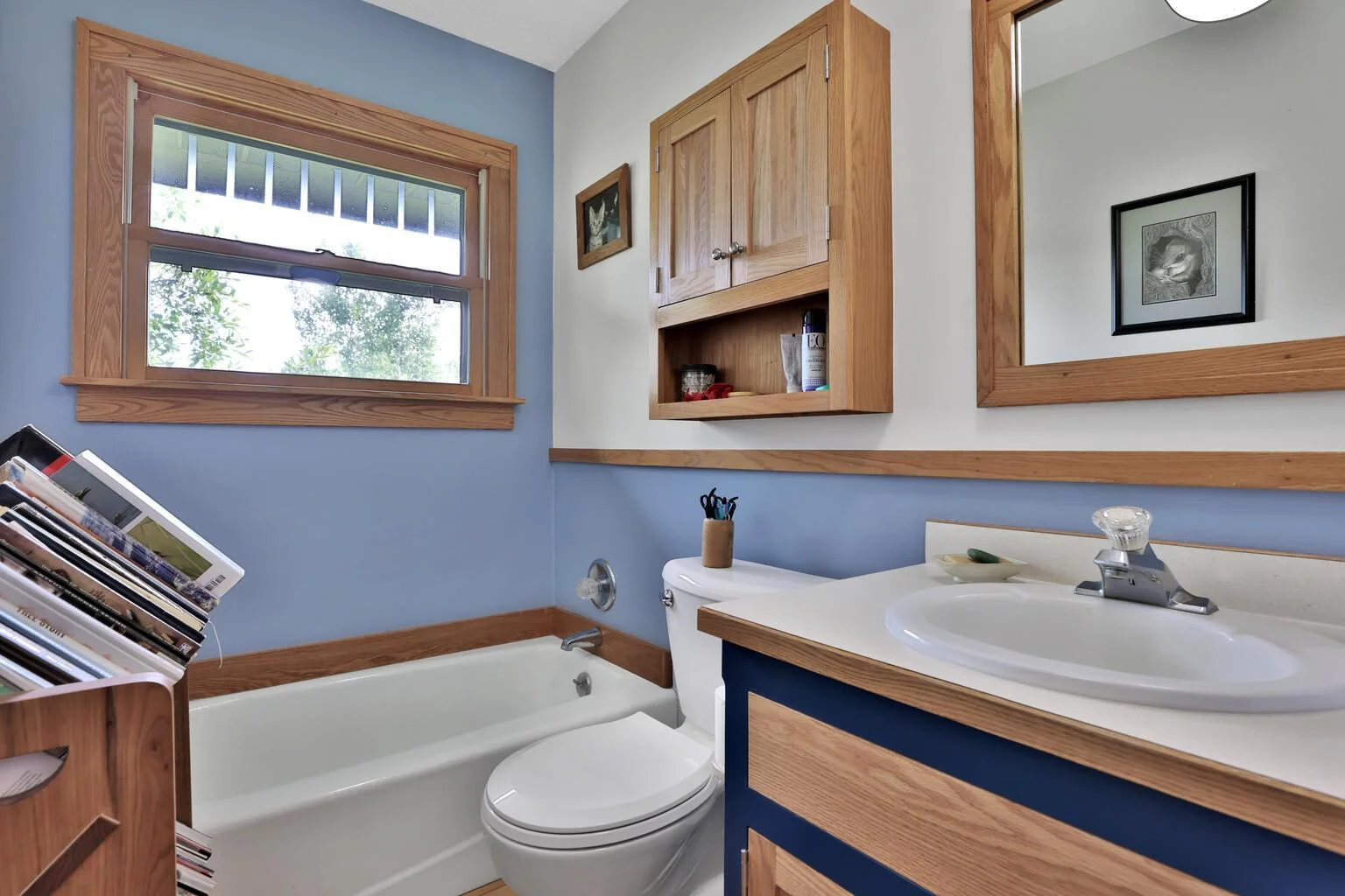 Main floor bath, behind the cat picture there is plumbing for a shower.