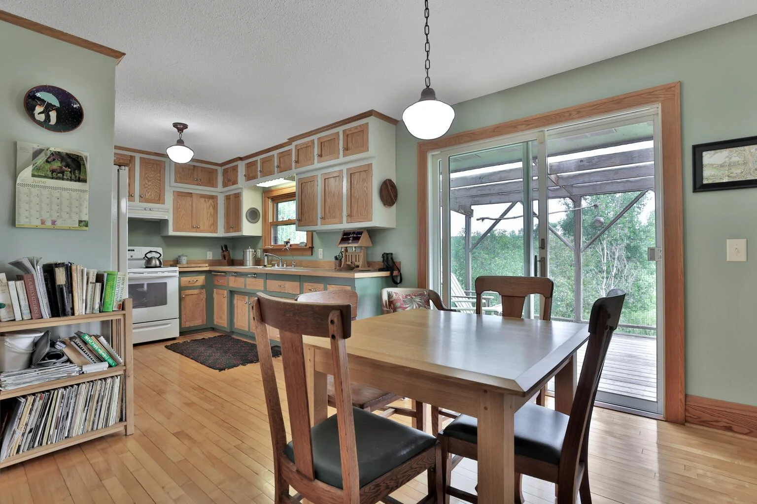 Dining overlooks the deck and nature out back