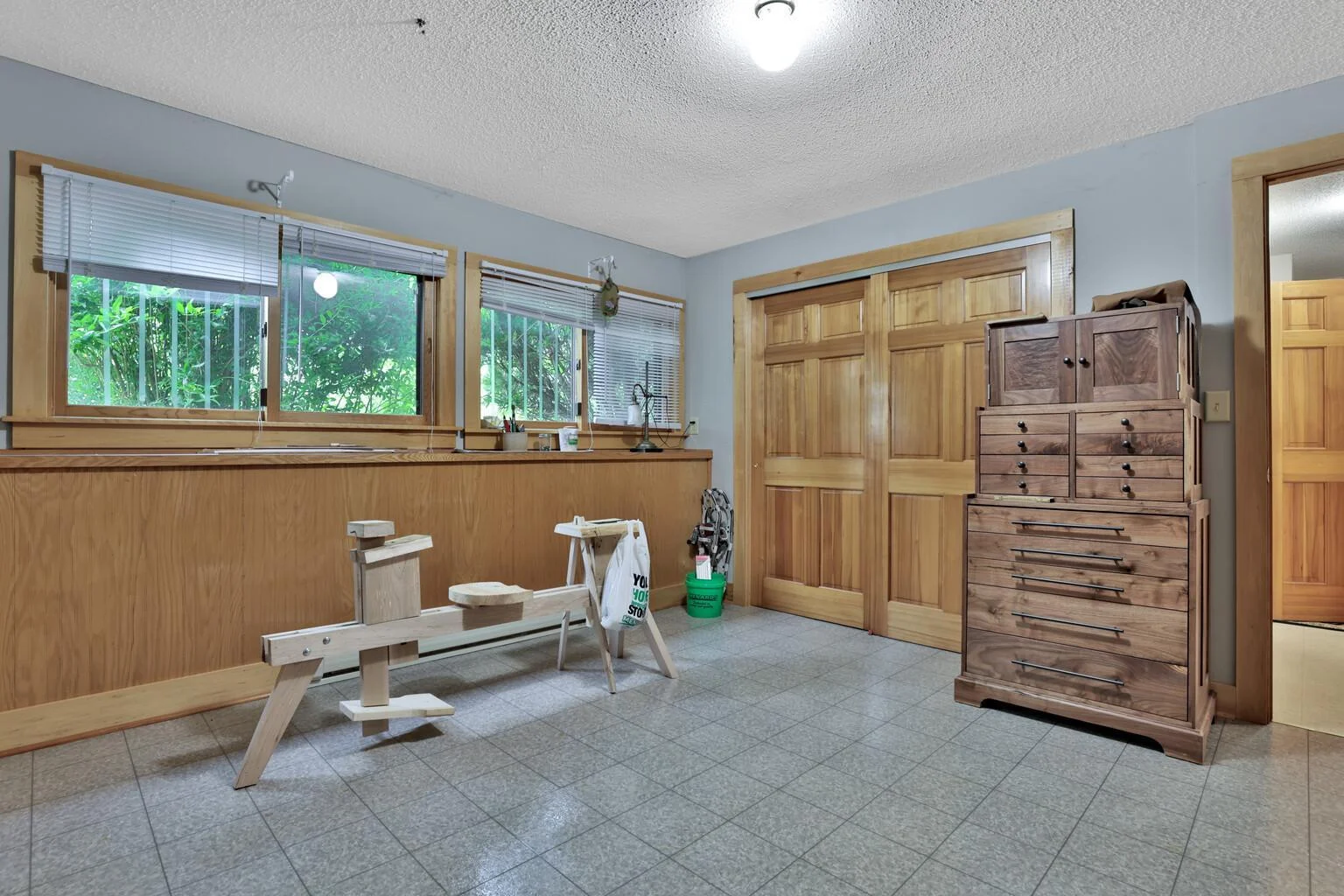 Bedroom 3 with paneled closet doors.
