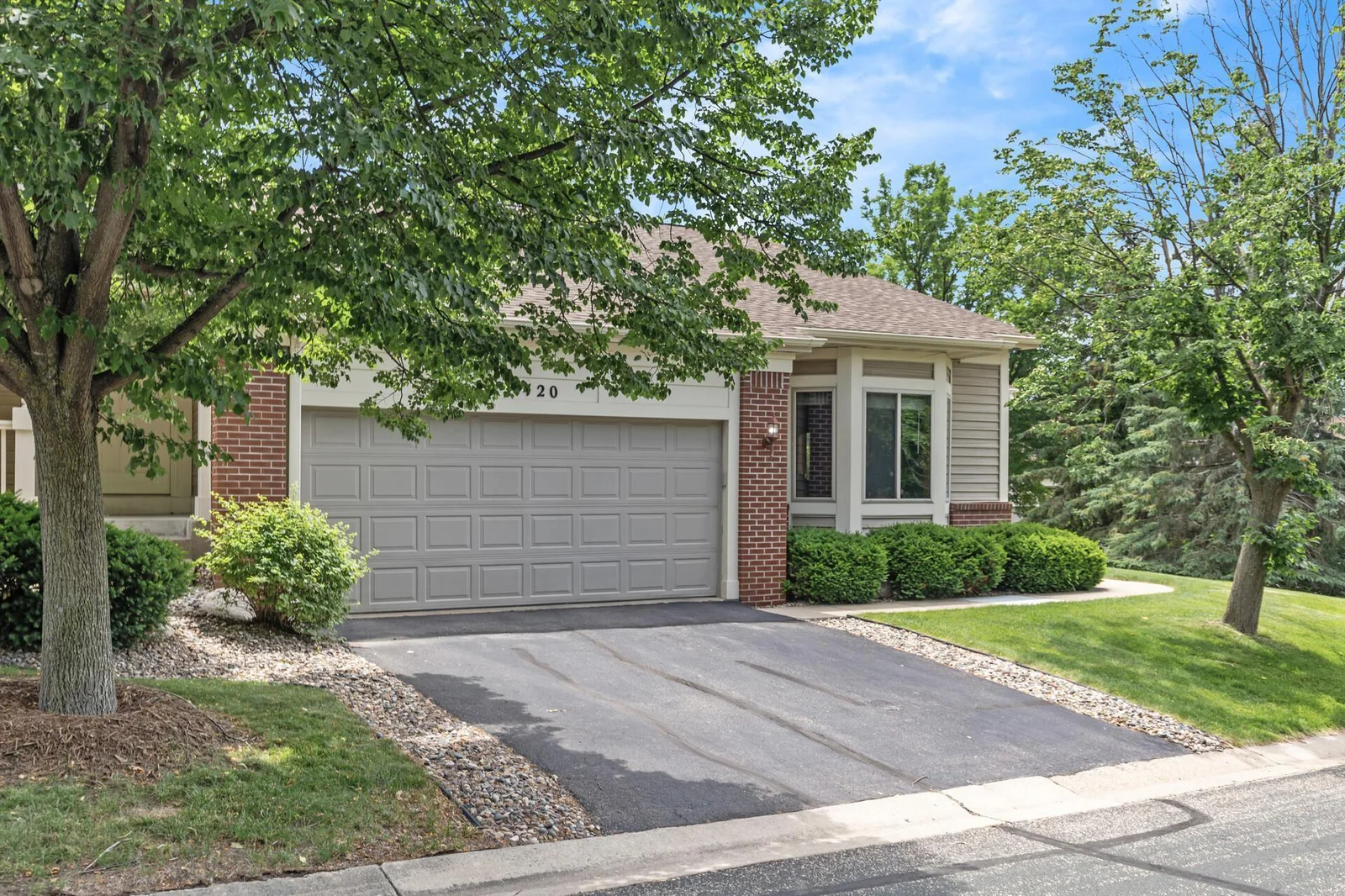 Mature foliage surround the home.