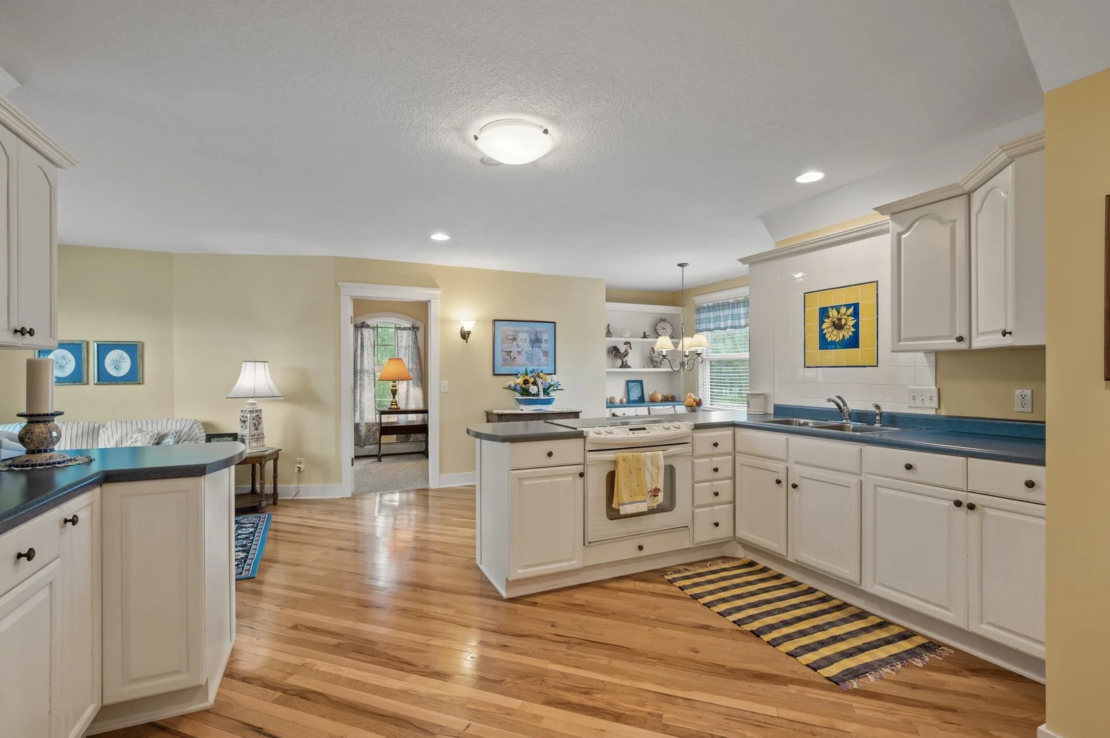 Full kitchen, hickory flooring, skylight with baseboard heat!