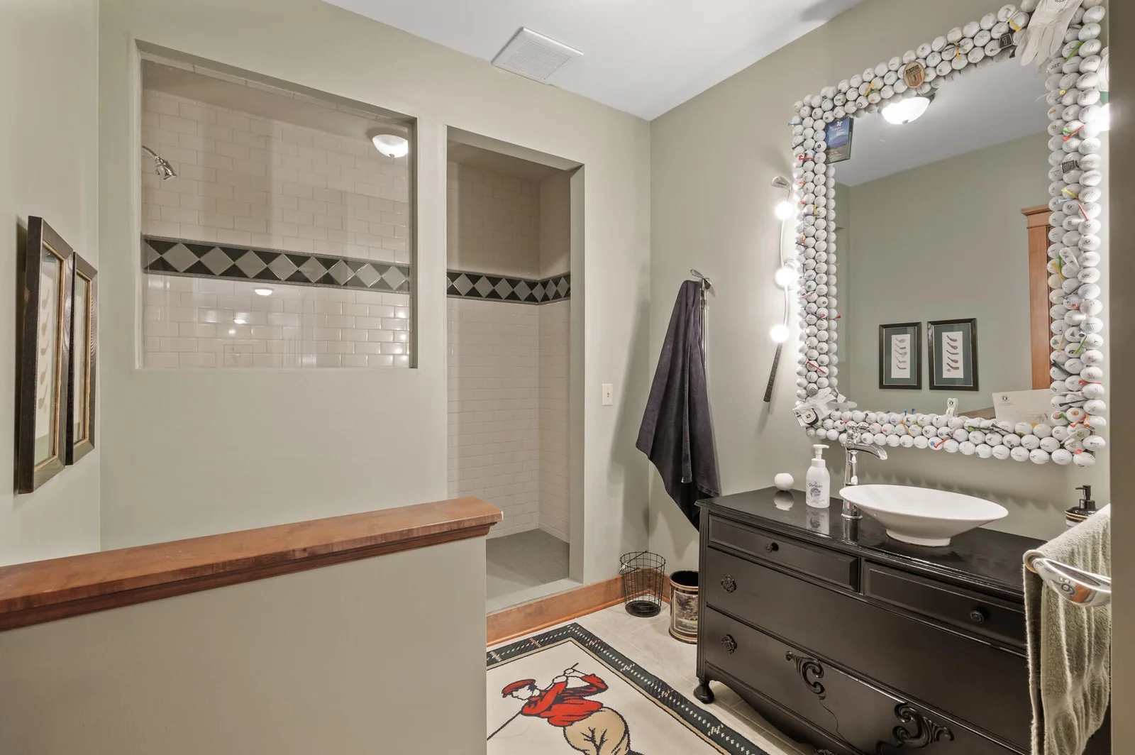 Office ensuite - golf themed and handcrafted mirror with fully tiled shower!