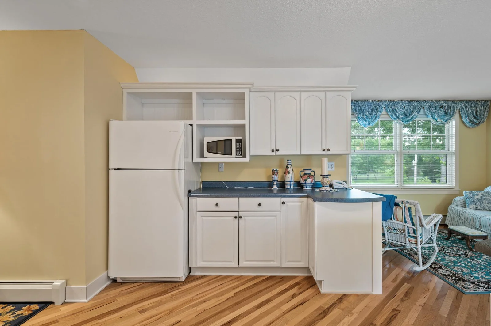 Lots of cabinets, stove, dishwasher, refrigerator and laminate countertops!