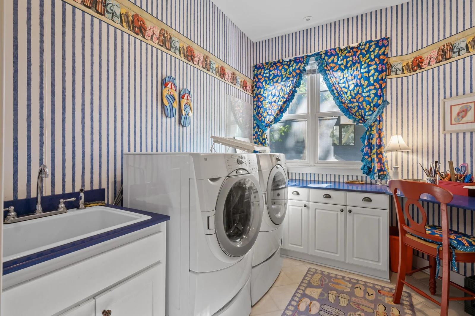Main floor laundry with Zodiac blue quartz, sink and laundry shoot!