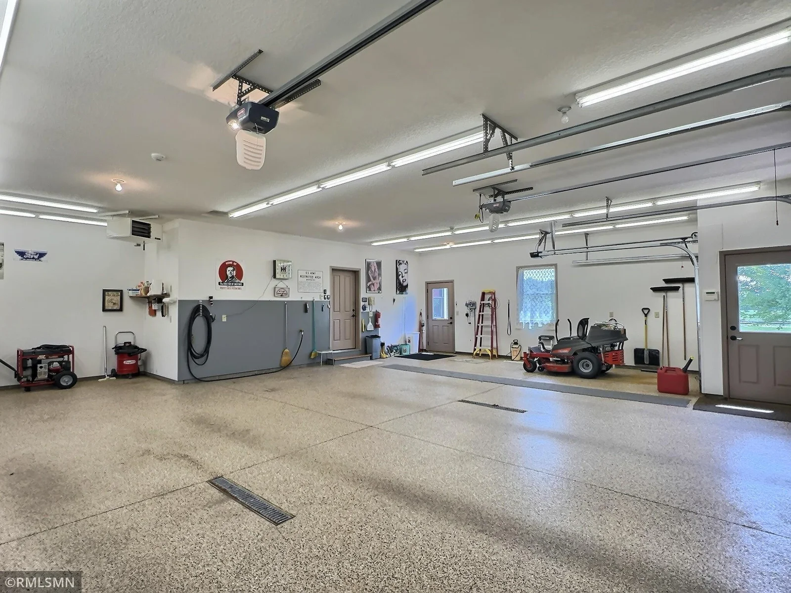 This oversized 2.5-stall garage is a dream for hobbyists and car enthusiasts alike. Featuring floor drains, and both hot and cold soft water hookup.