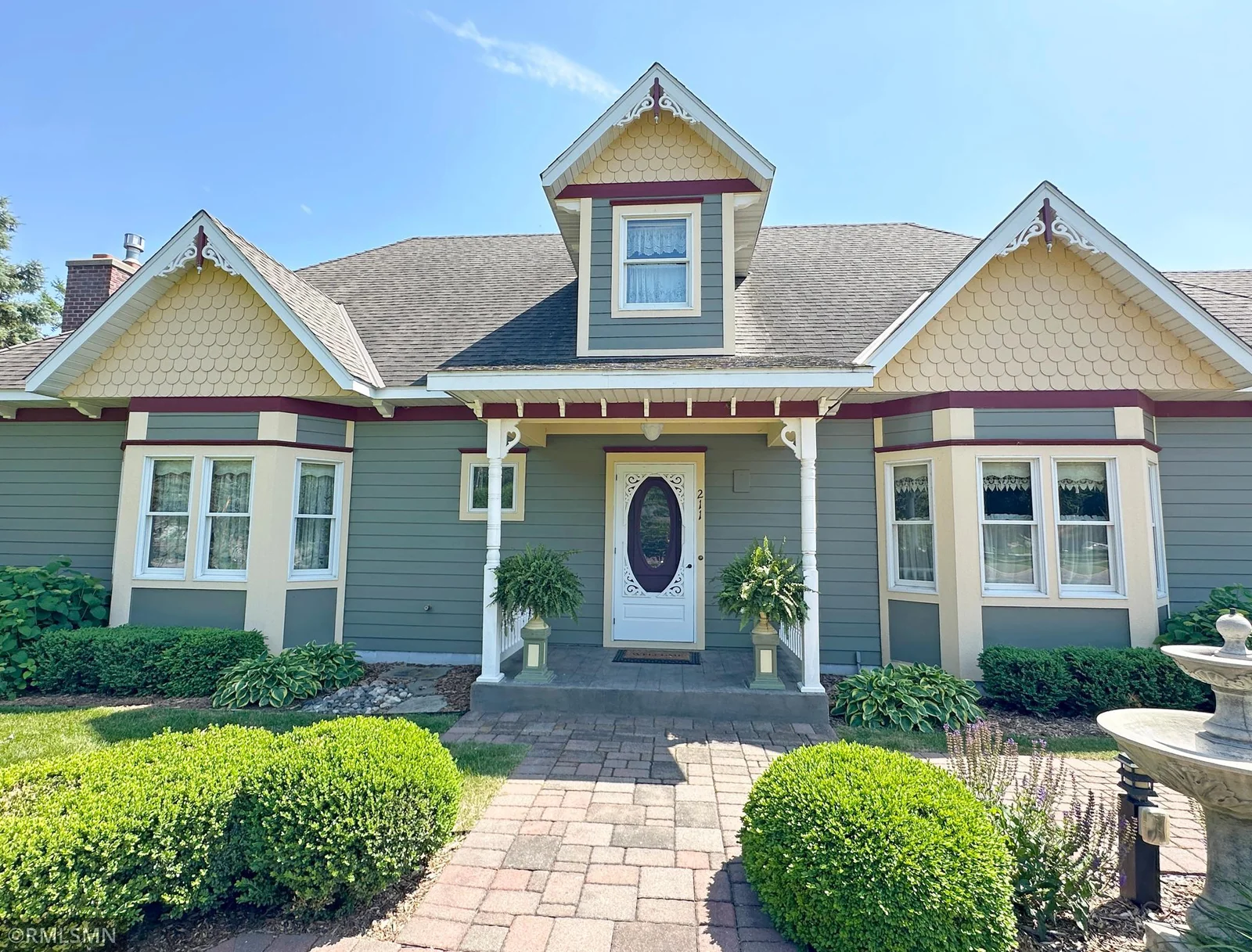 From the moment you arrive, you’re welcomed by a grand front entry framed with a paver walkway and stunning gardens.