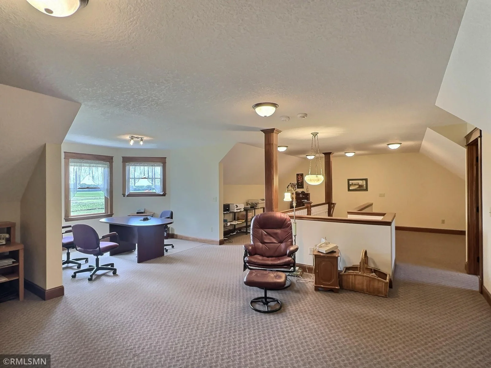 The expansive upper-level family room offers a spacious and versatile retreat, perfect for play, relaxing or working from home.