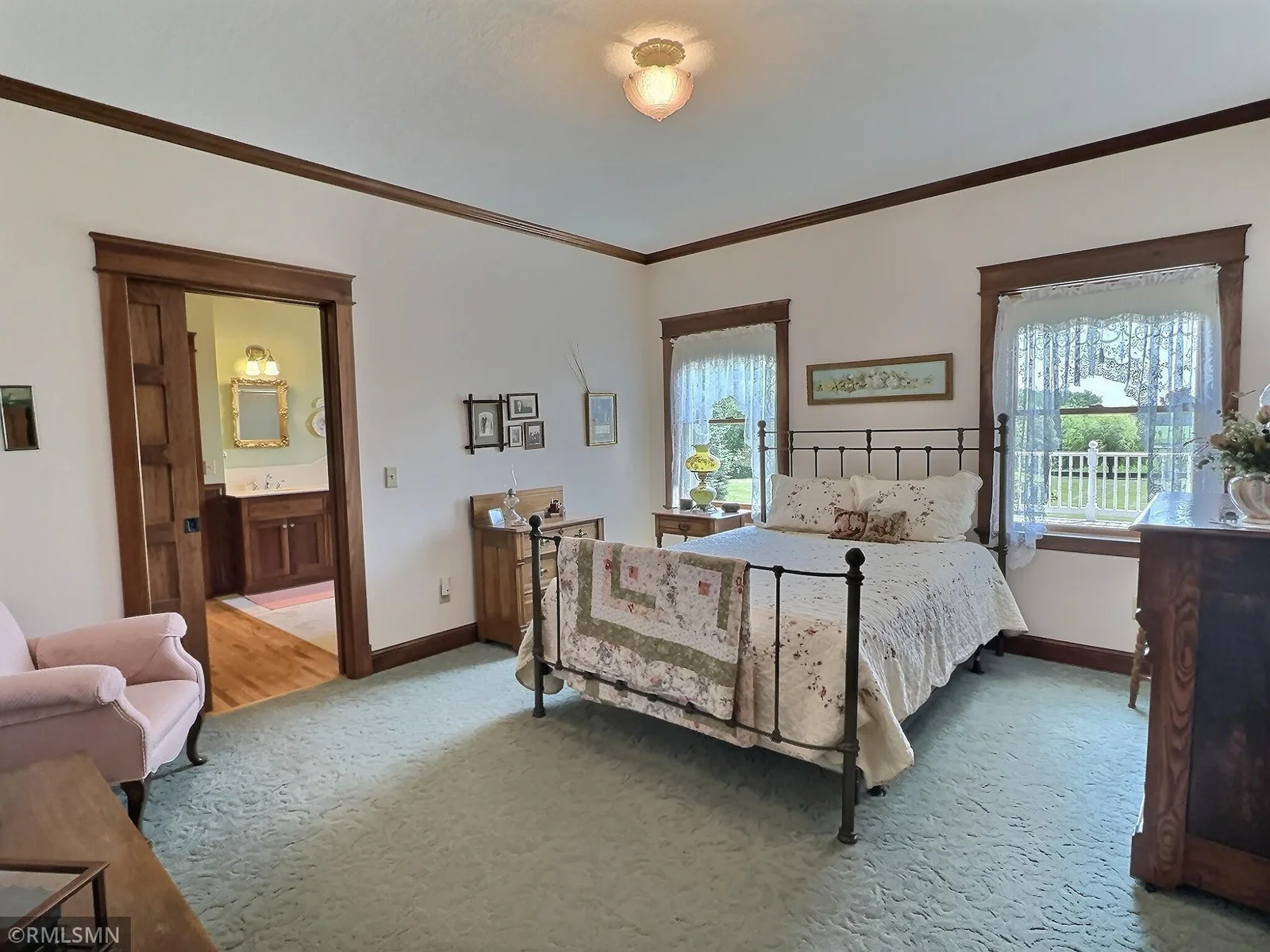 Retreat to one of the two main level bedrooms featuring backyard views, walk-in closet and walk-thru full bathroom.