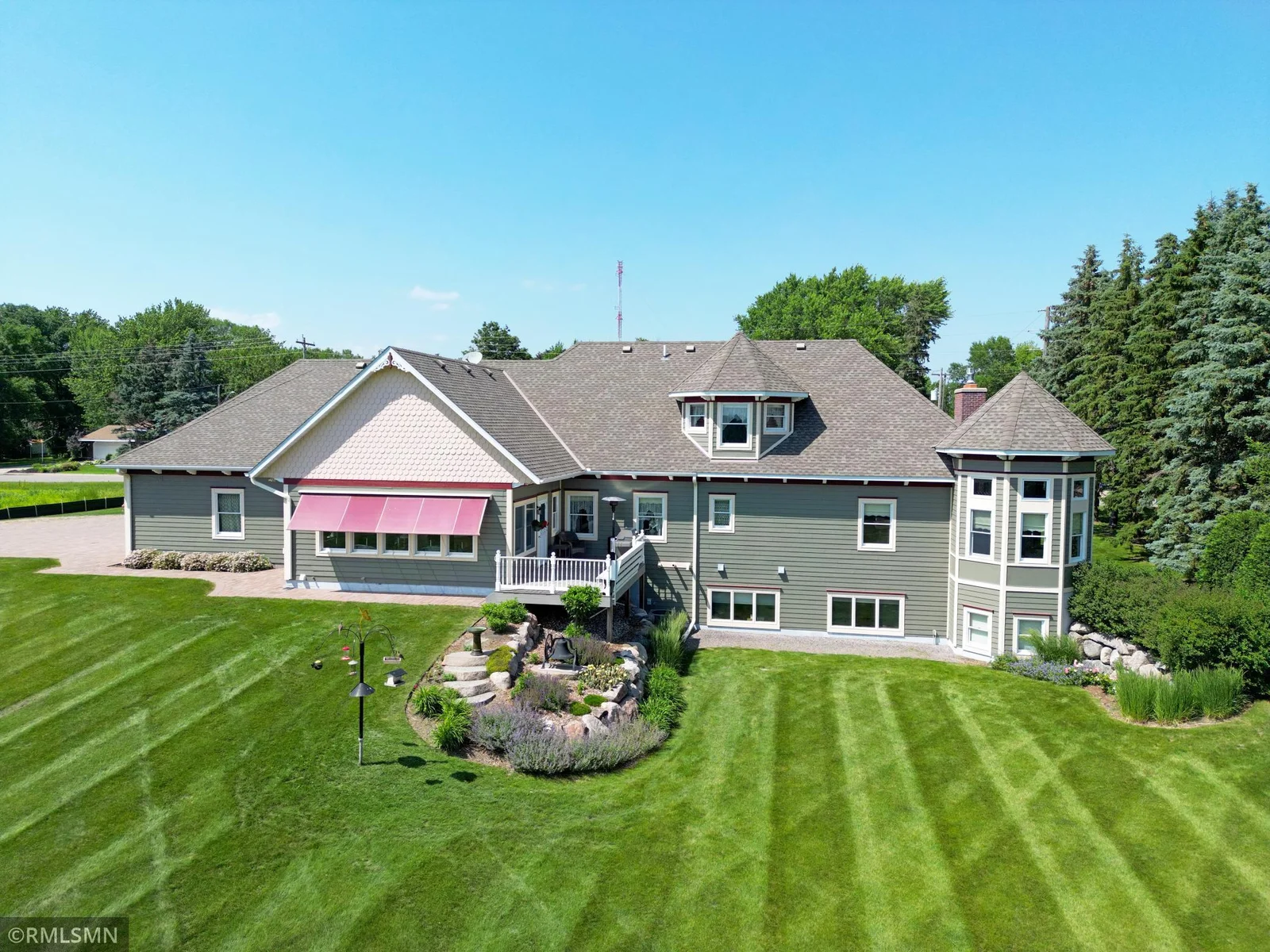 Enjoy shade throughout the day with a motorized porch awning that can be controlled from within the home.