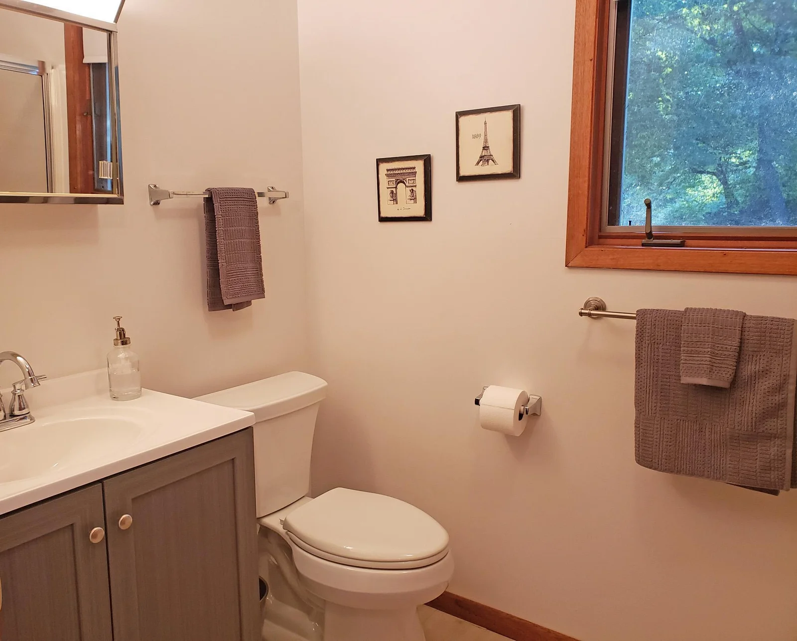New vanity and sink in main bathroom, New flooring also extends into bathrooms and laundry room