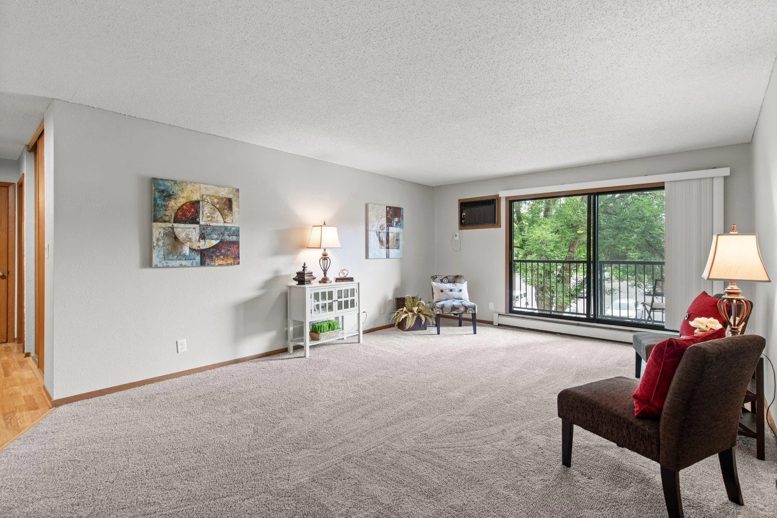 A wall of sliding doors brings in great natural light, and leads out to your private deck