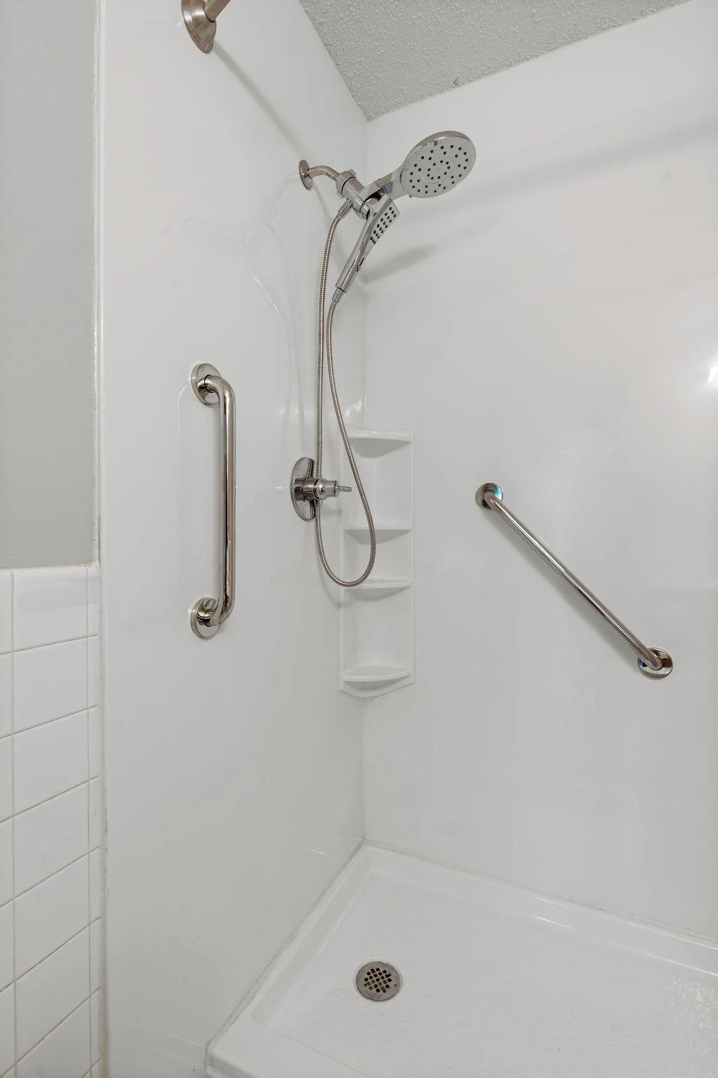 The bathtub was replaced in January with a beautiful oversized walk-in shower!
