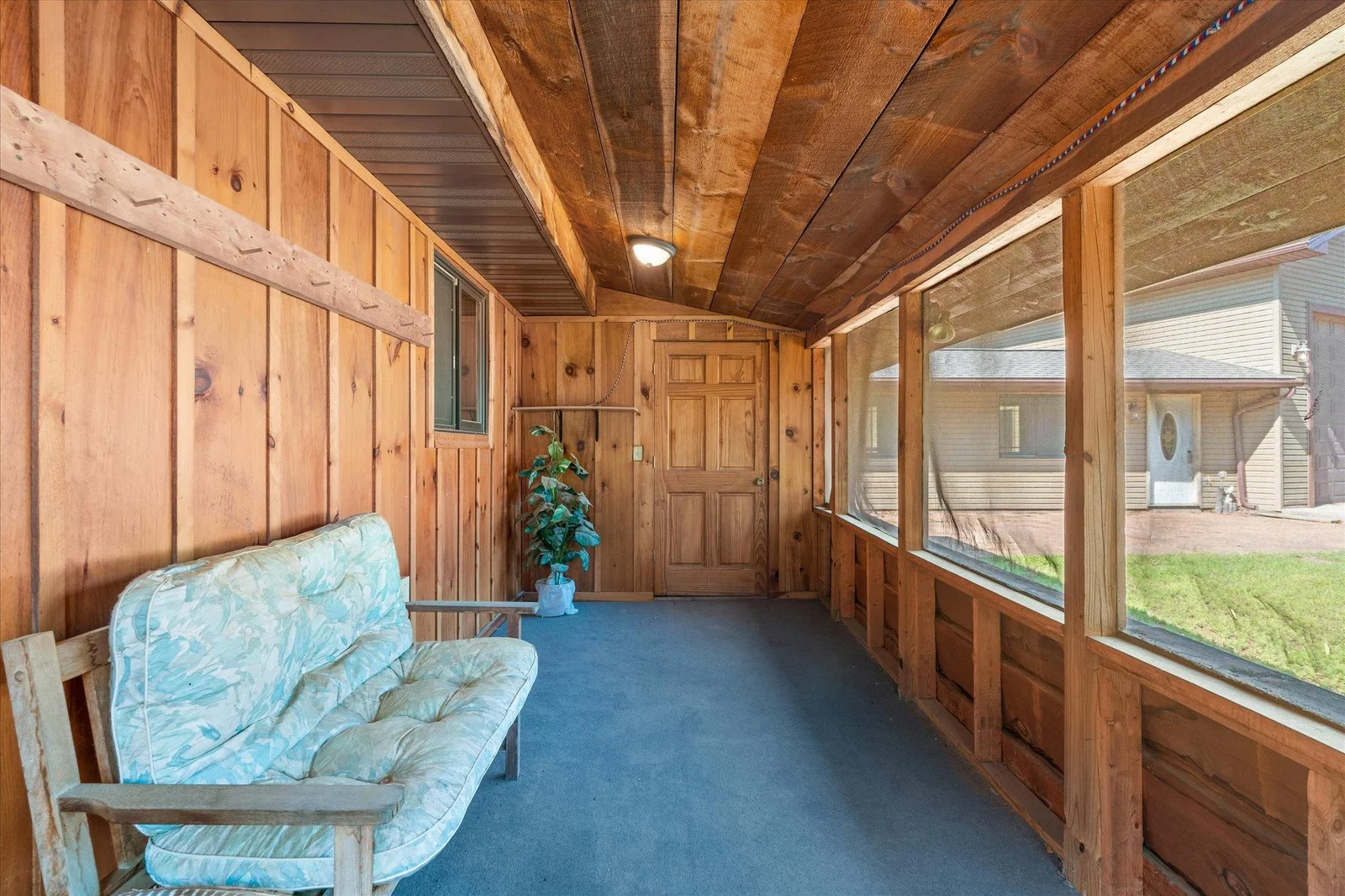 Screened porch of the back side of the home