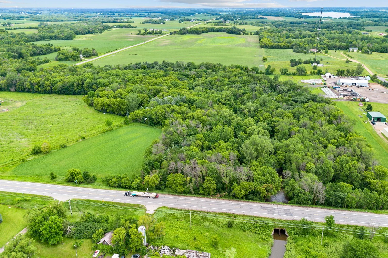Walk the property and you’ll notice something: the way sunlight filters through the trees, the natural spacing between higher and lower ground, the quiet that settles once you step past the road frontage.