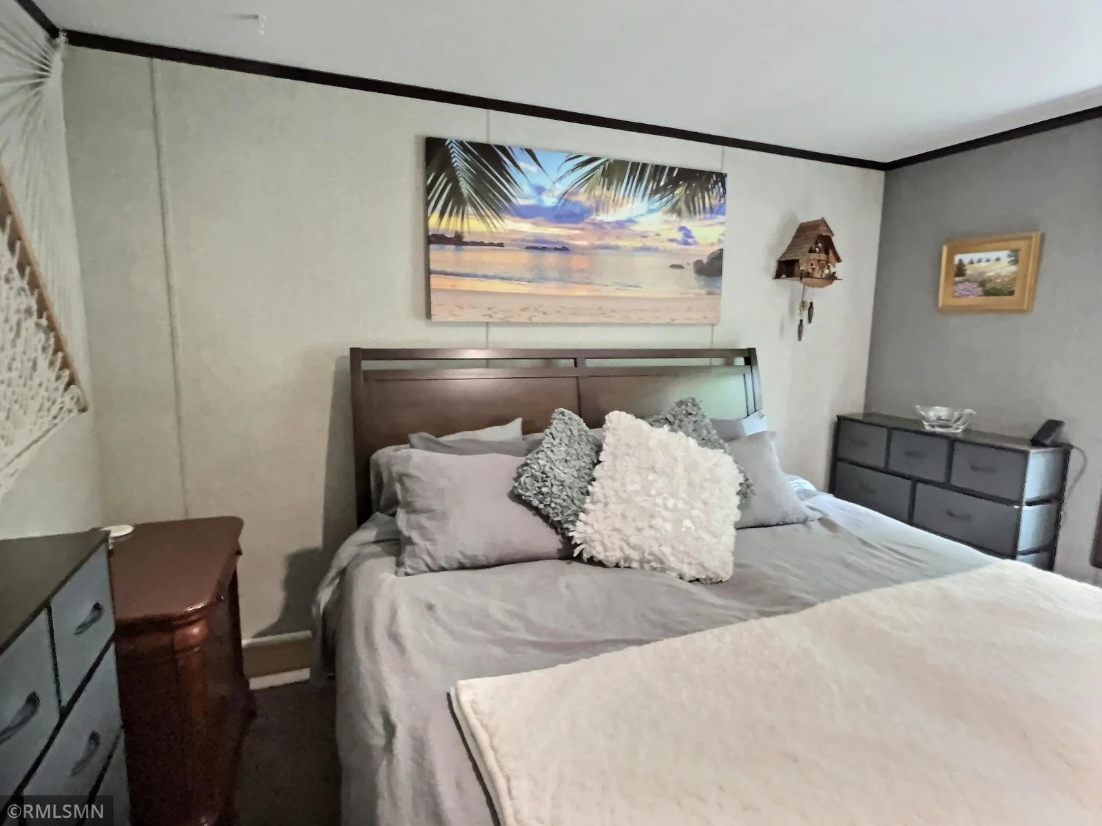 Enter the primary bedroom and you will be impressed with the space it provides and the great views the woods behind you.