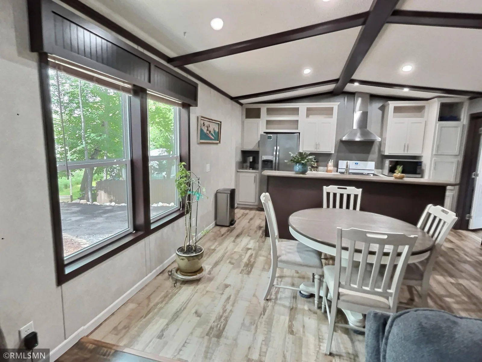 this dining area offers great natural light as well as recessed lighting.
