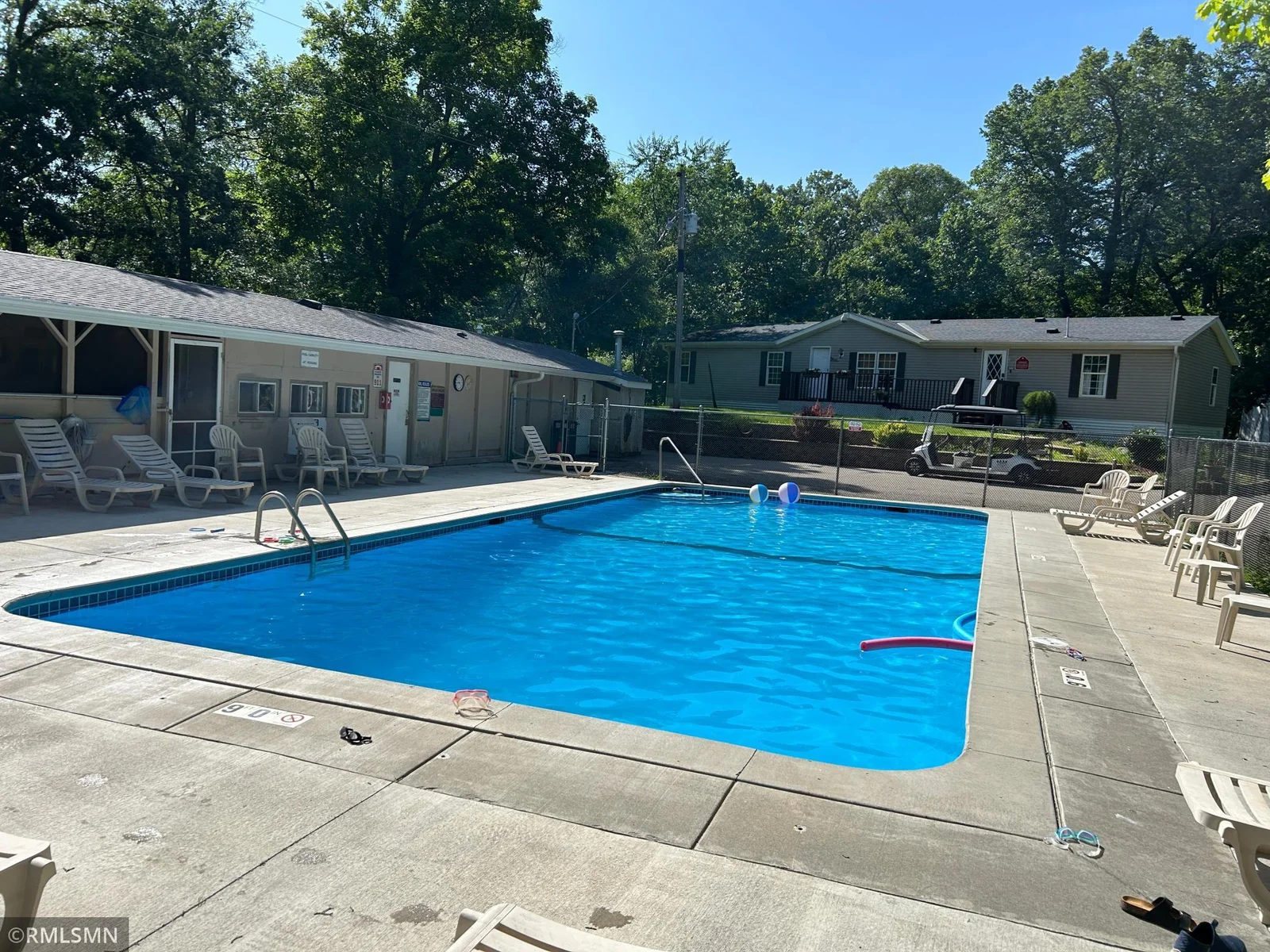 Beautiful community pool next to gathering space for your summer entertaining.