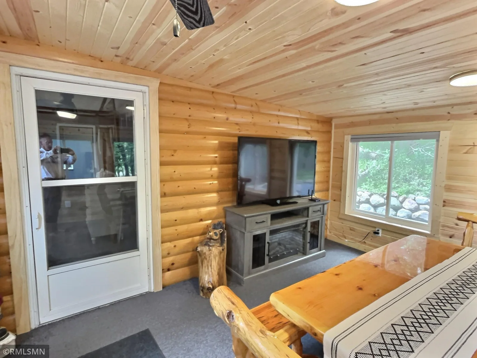 The four season porch currently has a table and tv for extra are to dine.