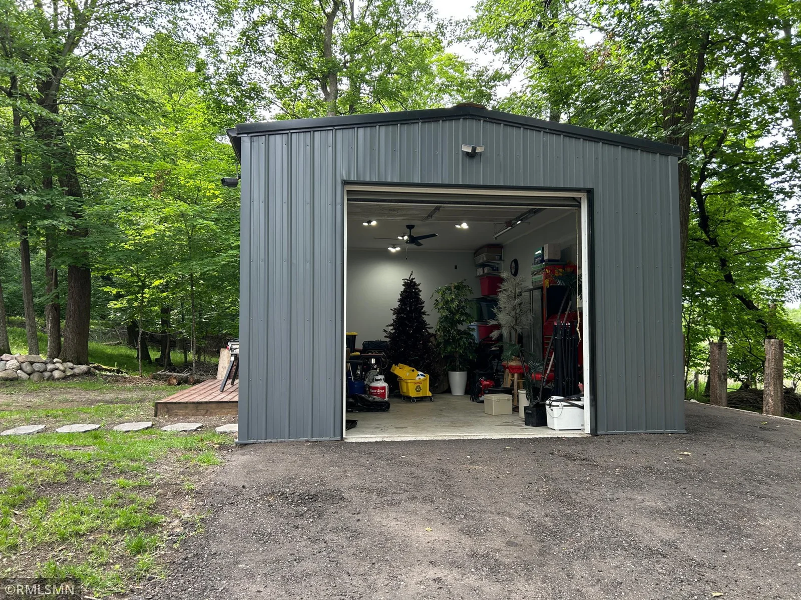 This insulated and concreted was recently added and provides ample room for parking and storage.  It also provides an over size door and window to allow natural light.