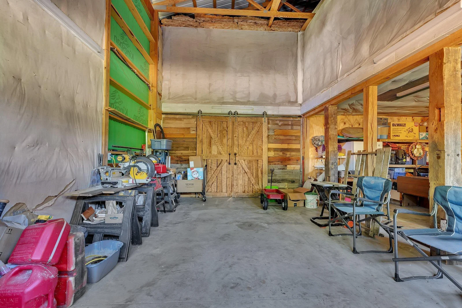 Large door garage space looking at heated shop barn door.jpg