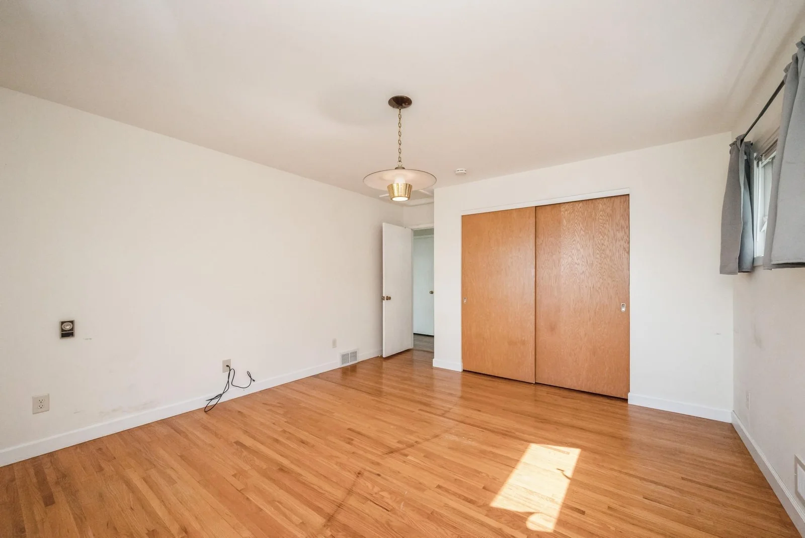 Primary Bedroom with hardwood floor