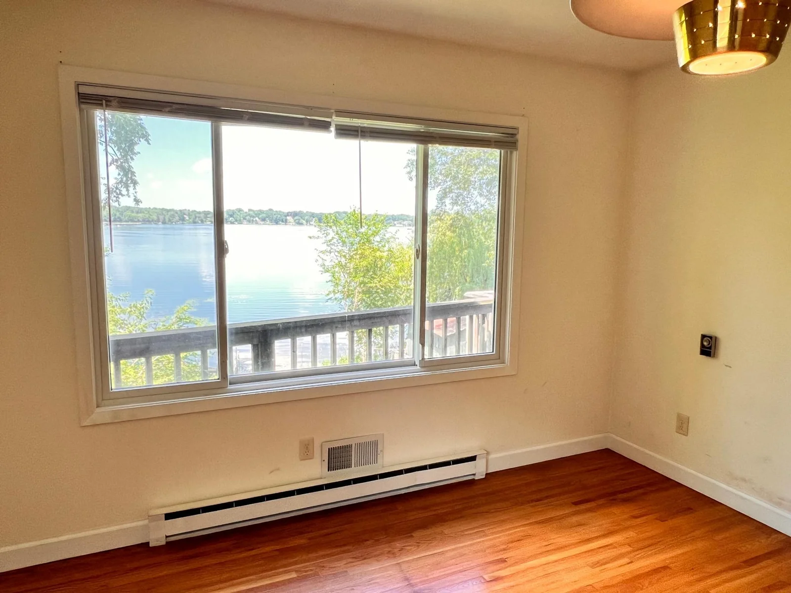 Primary Bedroom - Wake up to serene lake vistas every morning!