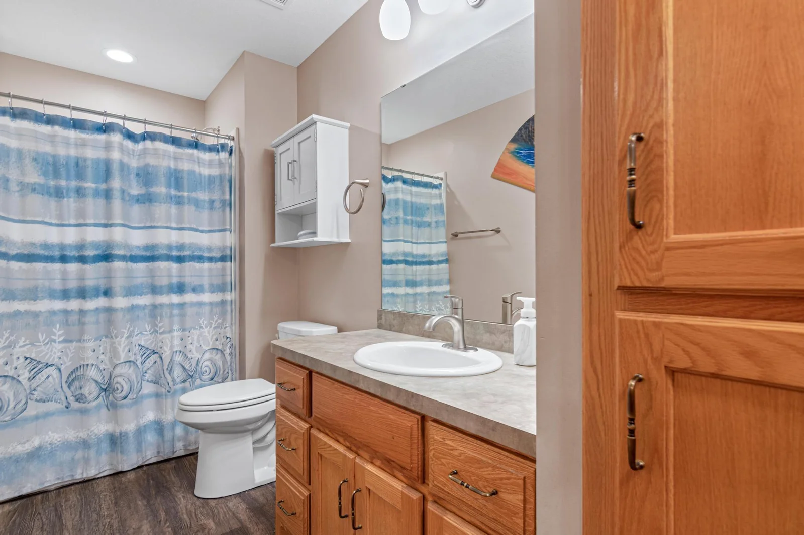 The main floor bathroom has a shower. There are no small bathrooms in the home!