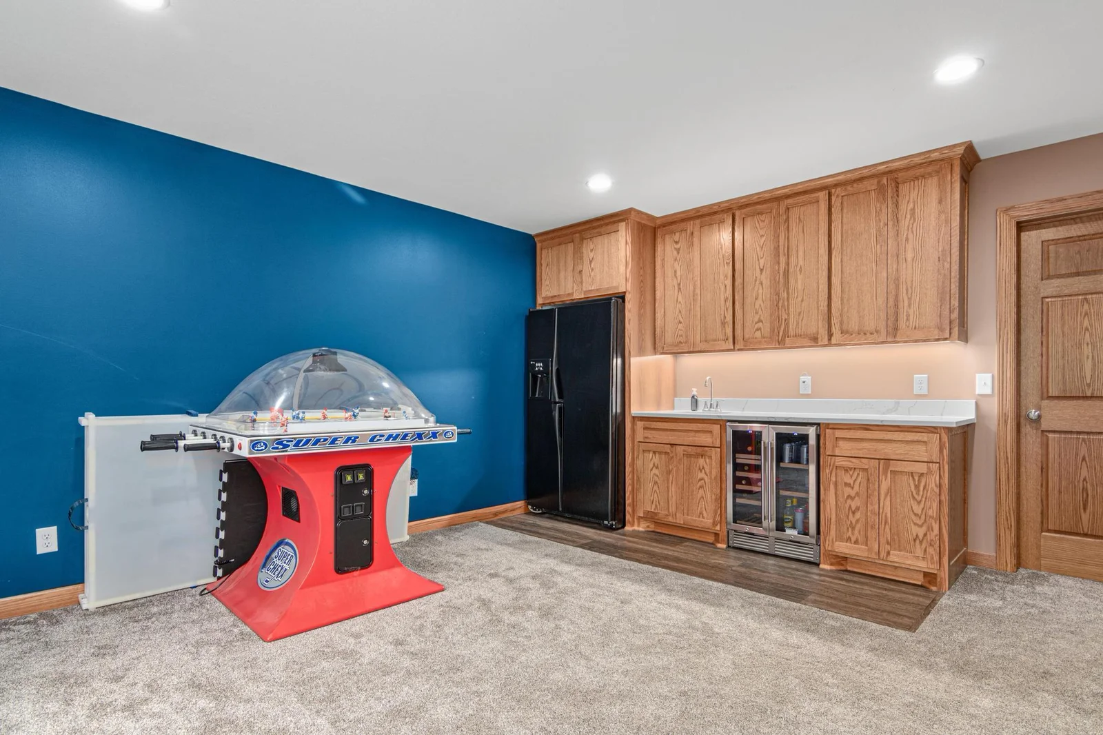 The lower level wet bar has a full-size fridge and a locking mini-fridge. There is also a lot of cupboard space and a beautiful countertop.