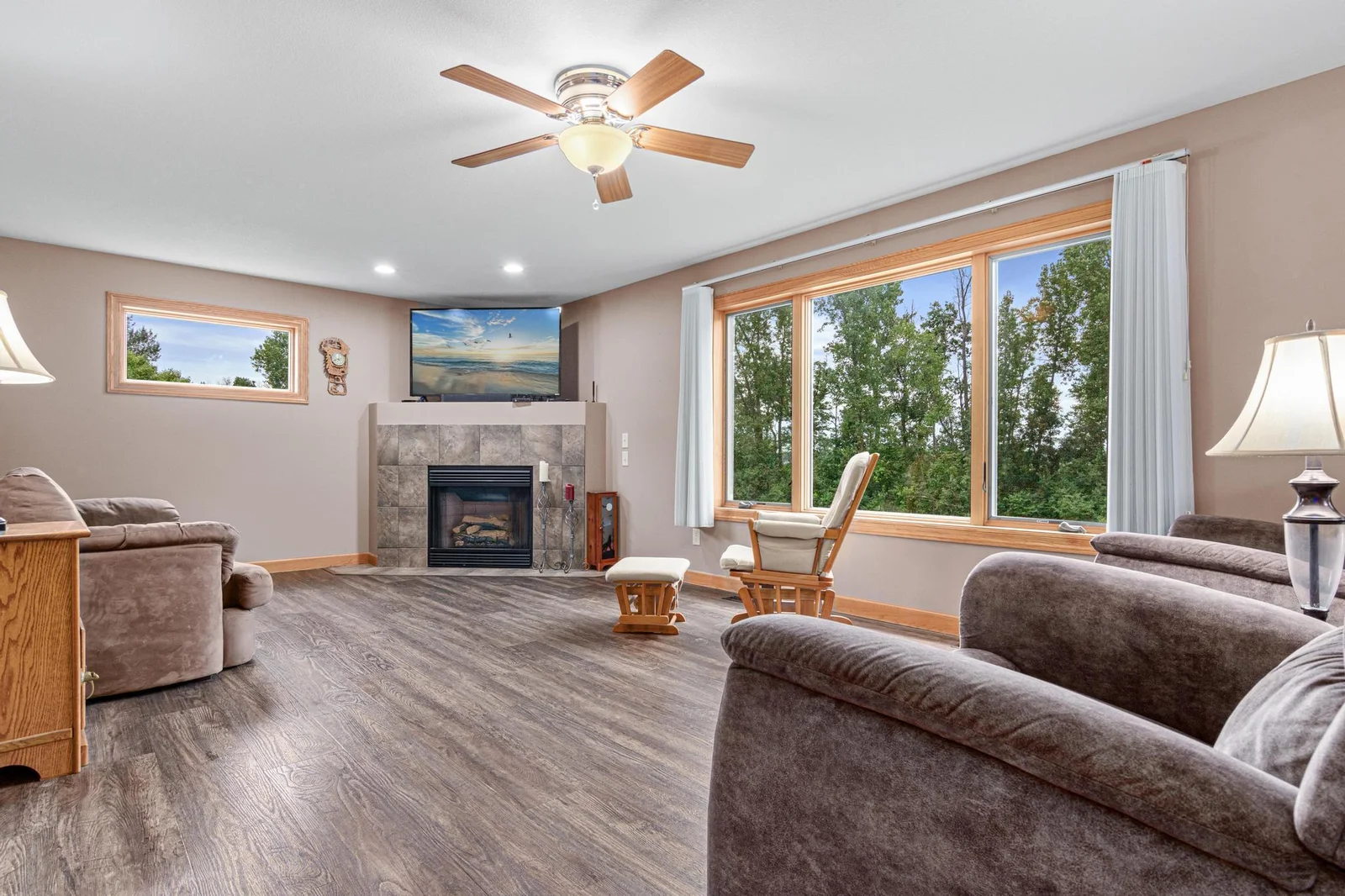 The living room has a cozy fireplace. The flooring in this area is newer. The home has Andersen windows.
