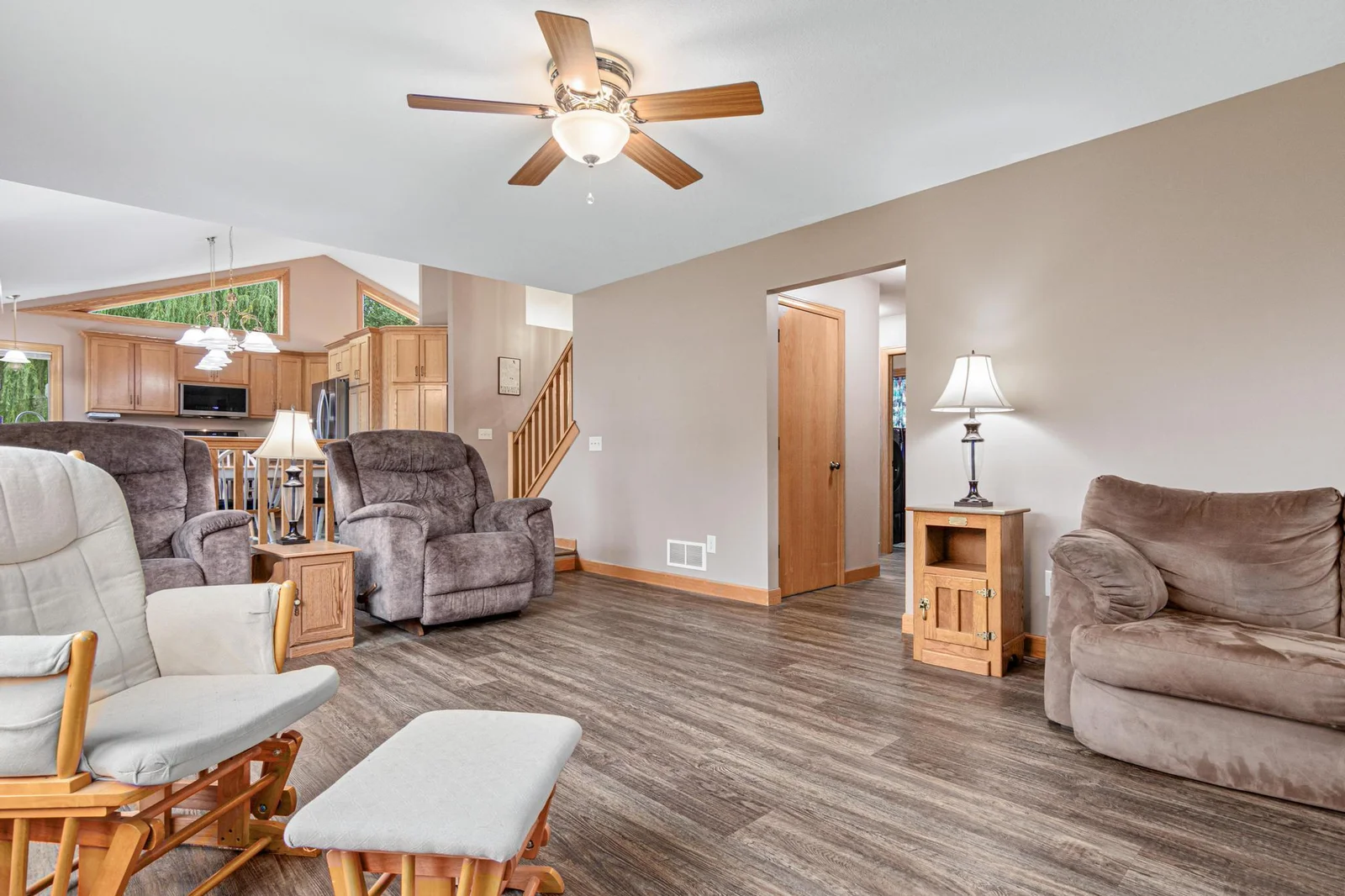 The home has a great layout. Down that hall is the secluded main floor bedroom and a bathroom with a shower.